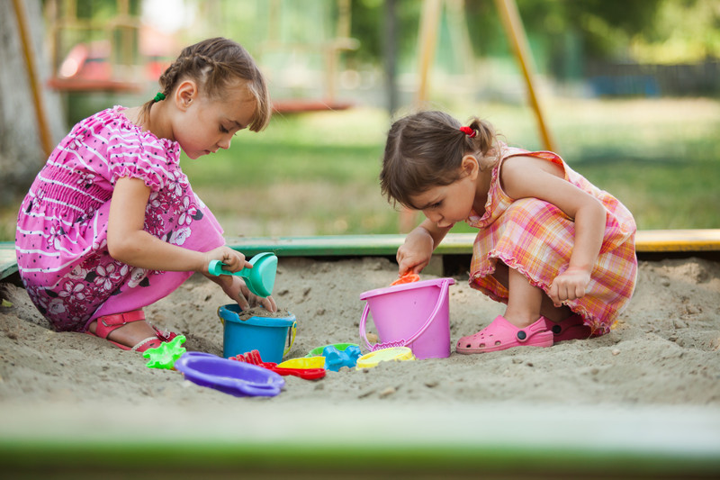 girls-digging-in-sandpit